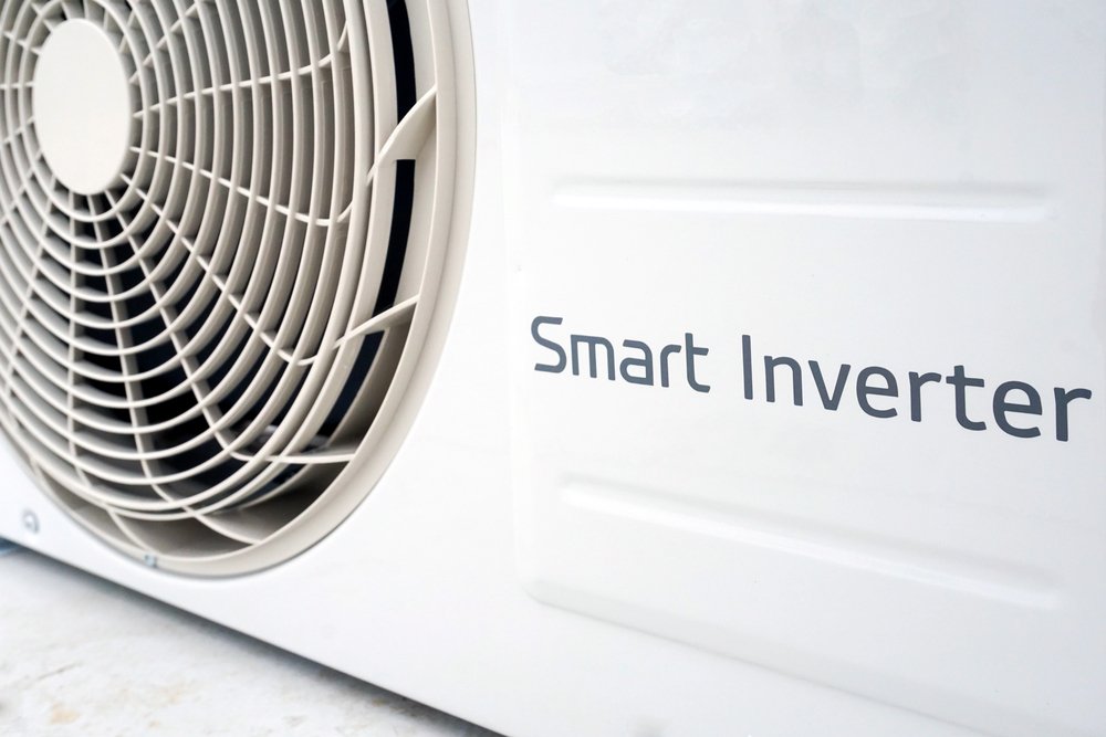A close-up of a heat pump outdoor unit with a “Smart Inverter” label, highlighting energy-efficient technology suitable for cold-climate performance.