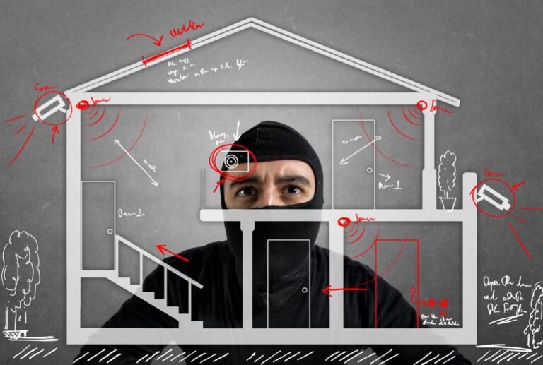 A burglar planning a break-in, highlighting blind spots in home alarm coverage in a security system illustration.
